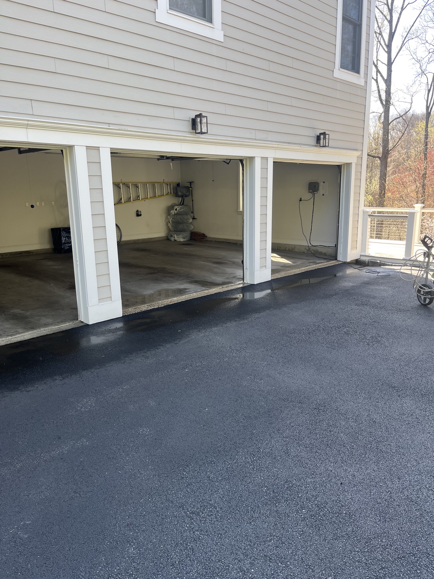 Finished three-car garage with open doors